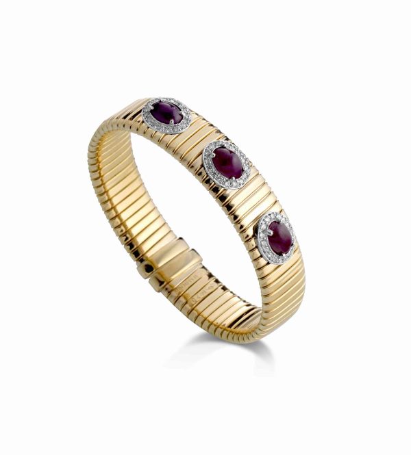 18KT GOLD TUBOGAS BRACELET WITH RUBY CABOCHON & DIAS